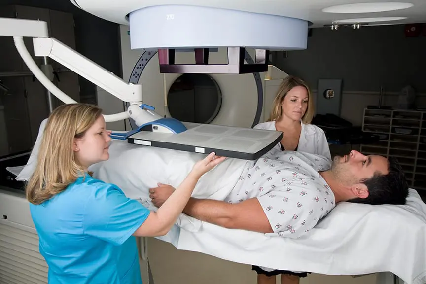 A radiation therapist is a healthcare professional who assists in the treatment of cancer.