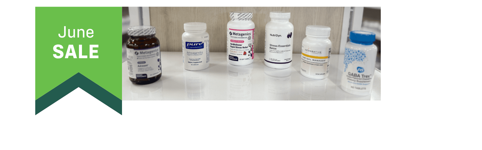 A green banner reads "June SALE" next to several supplement bottles lined up on a white surface.