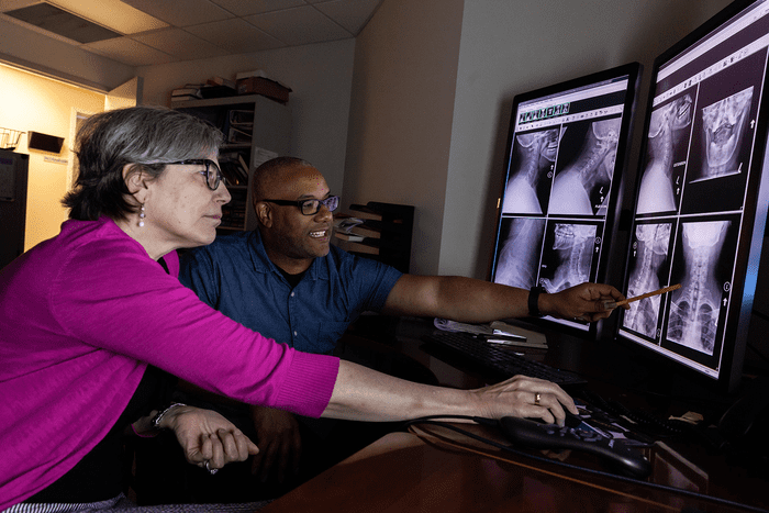 A radiologic technologist uses sophisticated equipment and technology.